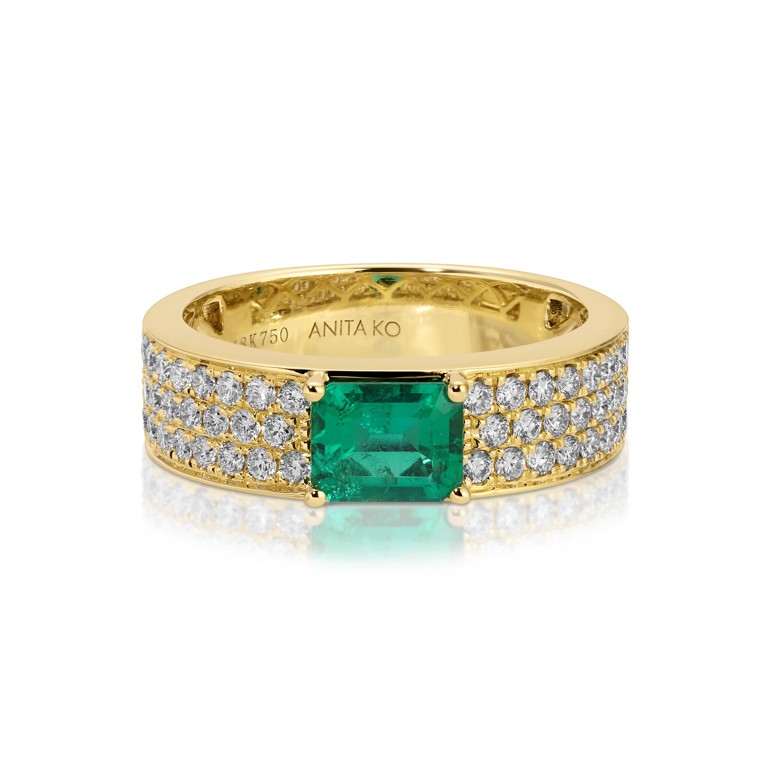 WIDE DIAMOND BAND WITH EMERALD CUT COLOMBIAN EMERALD CENTER
